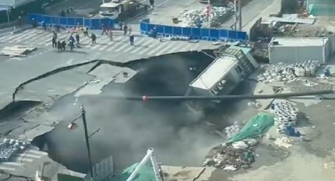 Monster sinkhole swallows Shanghai road intersection