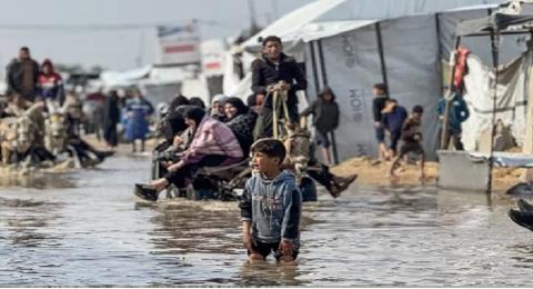 Heavy rains flood Gaza tents as Israel kills two more Palestinians