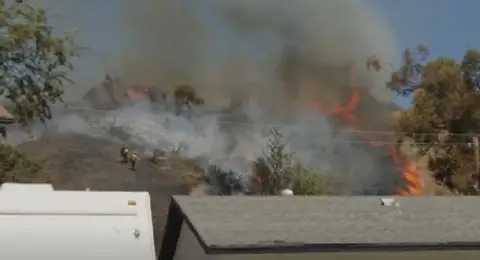 Massive wildfires tear across Western U.S.